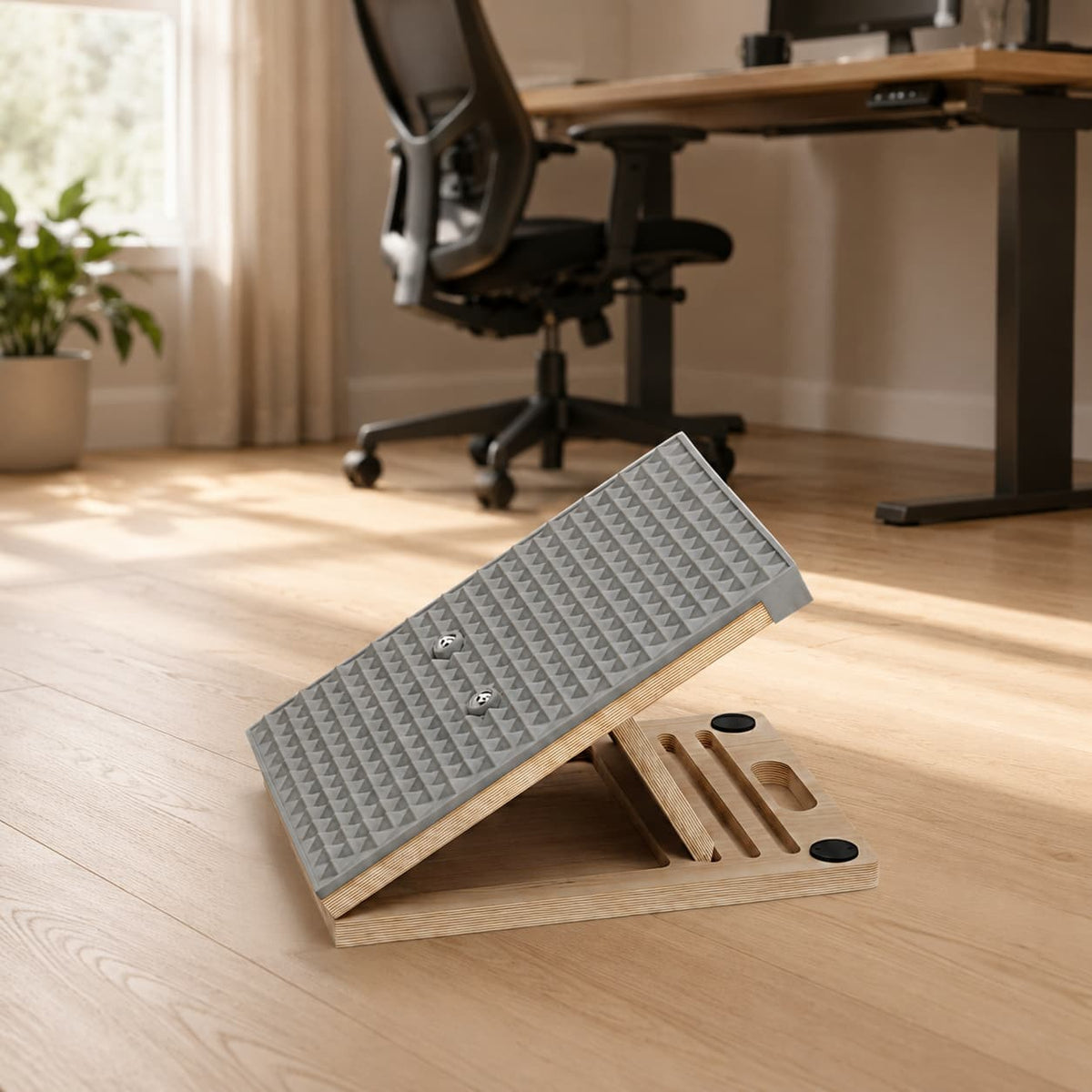 Frylr professional wooden slant board with grey silicone surface on a modern home office pale oak floor, perfect for daily barefoot posture correction exercises.