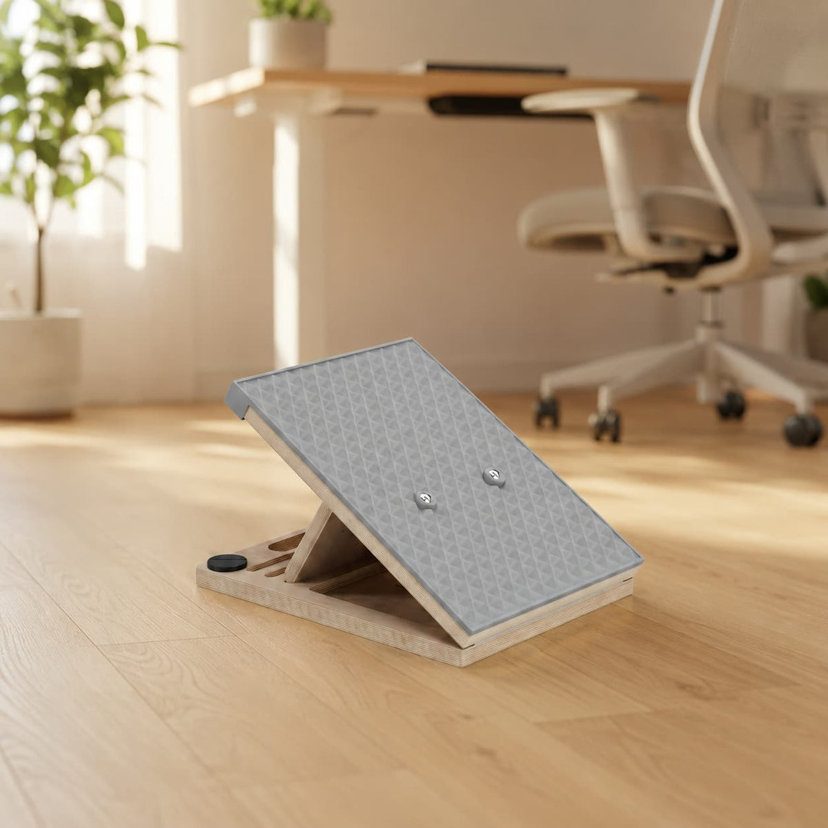 Side view of the Frylr wooden slant board in a home office, used by desk workers to stretch tight calves and relieve lower back pain.