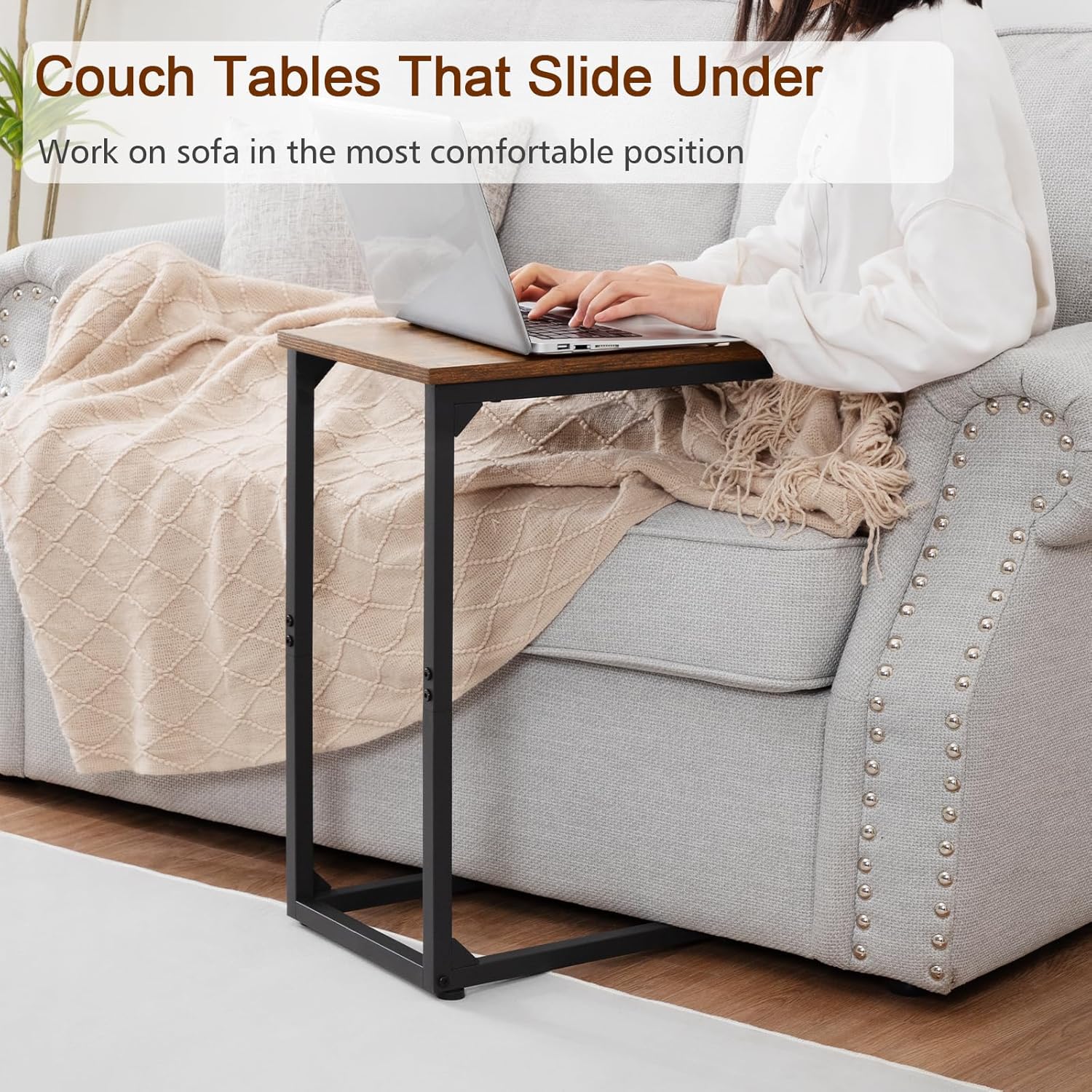 C-table slides under low clearance sofa for space saving home office.